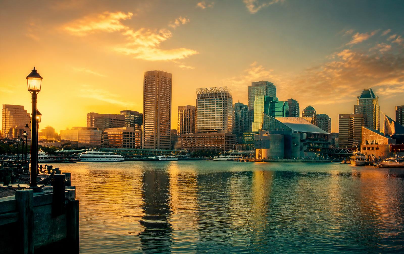Baltimore, Maryland skyline at sunset across the Inner Harbor